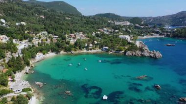 Picturesque seaside of Paleokastritsa, Corfu, Greece. Beautiful bay in Paleokastritsa in Corfu island, Greece. Panoramic view of Palaiokastritsa, boats and beach Corfu, Greece