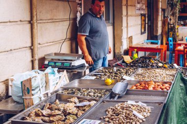 Catania, Italy - November 1, 2019: Seafood at fish market in Catania, Sicily, Italy. Fresh fish at the fish market in the old Town of Catania in the province of Sicily in Italy.  clipart