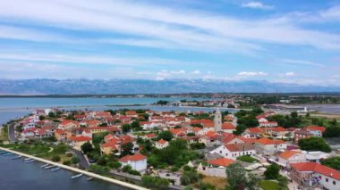 Historic town of Nin laguna aerial view with Velebit mountain background, Dalmatia region of Croatia. Aerial view of the famous Nin lagoon and medieval in Croatia