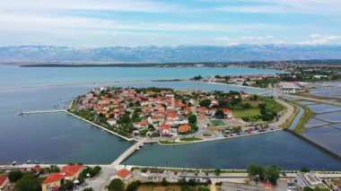 Historic town of Nin laguna aerial view with Velebit mountain background, Dalmatia region of Croatia. Aerial view of the famous Nin lagoon and medieval in Croatia