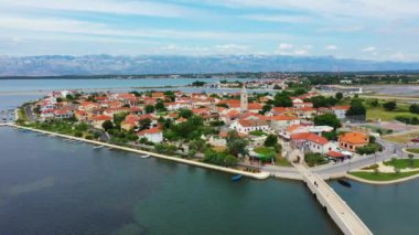 Historic town of Nin laguna aerial view with Velebit mountain background, Dalmatia region of Croatia. Aerial view of the famous Nin lagoon and medieval in Croatia