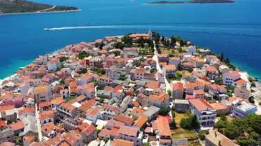 Aerial view of Primosten old town on the islet, Dalmatia, Croatia. Primosten, Sibenik Knin County, Croatia. Resort town on the Adriatic coast. Aerial view of adriatic town Primosten, Croatia