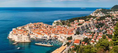 Dubrovnik a city in southern Croatia fronting the Adriatic Sea, Europe. Old city center of famous town Dubrovnik, Croatia. Picturesque view on Dubrovnik old town (medieval Ragusa) and Dalmatian Coast. clipart