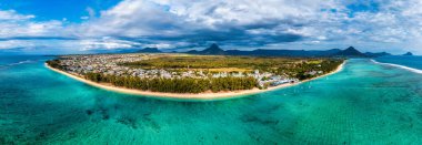 Beach of Flic en Flac with beautiful peaks in the background, Mauritius. Beautiful Mauritius Island with gorgeous beach Flic en Flac, aerial view from drone. Flic en Flac Beach, Mauritius Island. clipart
