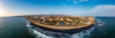 Aerial drone of the popular resort town of Meloneras, with hotels and restaurants, near the Maspalomas dunes in Gran Canaria, Canary Islands, Spain clipart