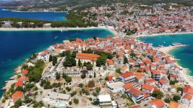 Aerial view of Primosten old town on the islet, Dalmatia, Croatia. Primosten, Sibenik Knin County, Croatia. Resort town on the Adriatic coast. Aerial view of adriatic town Primosten, Croatia