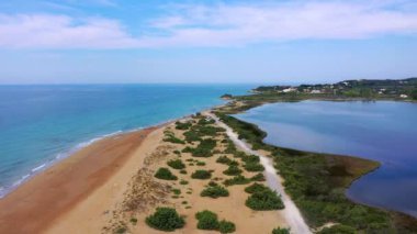 Aerial drone view of Halikounas Beach and Lake Korission, Corfu island, Ionian Sea, Greece. Halikounas Beach, Corfu Island. View of the deserted, sandy, windy beach on the western part of Corfu.