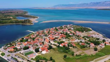 Historic town of Nin laguna aerial view with Velebit mountain background, Dalmatia region of Croatia. Aerial view of the famous Nin lagoon and medieval in Croatia