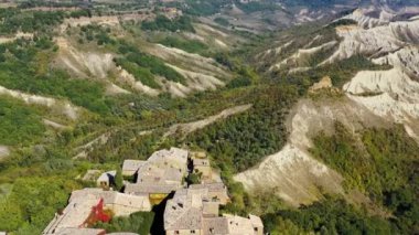 The famous Civita di Bagnoregio on a sunny day. Province of Viterbo, Lazio, Italy. Medieval town on the mountain, Civita di Bagnoregio, popular touristic stop at Tuscany, Italy.