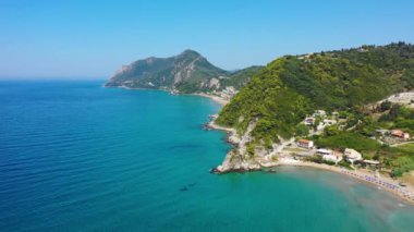 Aerial drone view over western coast and Glyfada beach, Island of Corfu, Greece. Glyfada Beach at Corfu Greece during the day. 