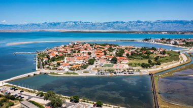 Historic town of Nin laguna aerial view with Velebit mountain background, Dalmatia region of Croatia. Aerial view of the famous Nin lagoon and medieval in Croatia