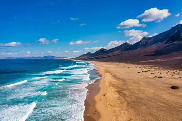 stock image Amazing Cofete beach with endless horizon. Volcanic hills in the background and Atlantic Ocean. Cofete beach, Fuerteventura, Canary Islands, Spain. Playa de Cofete, Fuerteventura, Canary Islands.