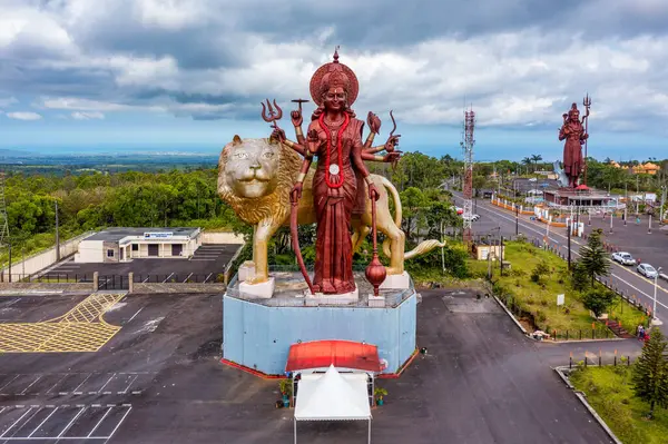 stock image A powerful Statue of the Hindu goddess Durga Maa with a golden lion in sacred Ganga Talao. Shiva statue at Grand Bassin temple, the world's tallest Shiva temple, it is 33 meters tall. Mauritius