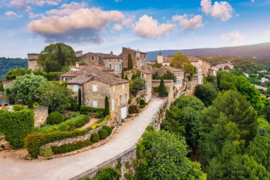 Menerbes village in Provence on a summer day, France, Luberon, Vaucluse. Village of Menerbes, the village and the Luberon mountains also called the most beautiful village of Luberon, France, Provence. clipart