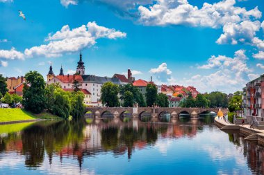 Medieval Town Pisek and historic stone bridge over river Otava in the Southern Bohemia, Czech Republic. Pisek Stone Bridge, the oldest preserved early Gothic bridge in the Czech republic. clipart