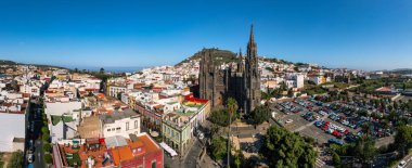 Aerial view of the Parroquia de San Juan Bautista de Arucas church in Arucas town, Gran Canaria, Canary Islands, Spain. Historic Neo-Gothic cathedral in Arucas.  clipart