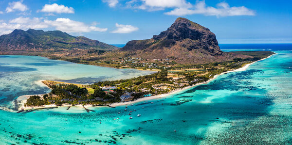 Tropical scenery, beautiful beaches of Mauritius island, Le Morne, popular luxury resort. Le Morne beach luxury resorts, Mauritius. Luxury beach in Mauritius, sandy beach with palms and blue ocean. 