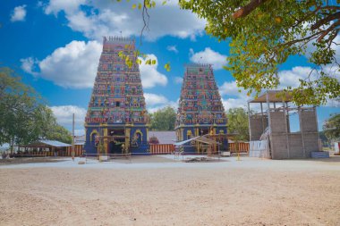 The Naguleswaram temple with a cloudy blue sky in the background in Sri Lanka clipart