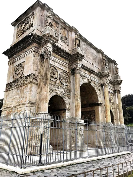 Vertical Shot Arch Constantine Rome Italy Surrounded Metal Gate — Stock Photo, Image