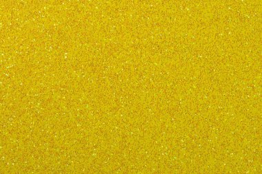 Koyu sarı simli bir arka plan. Tasarım için harika