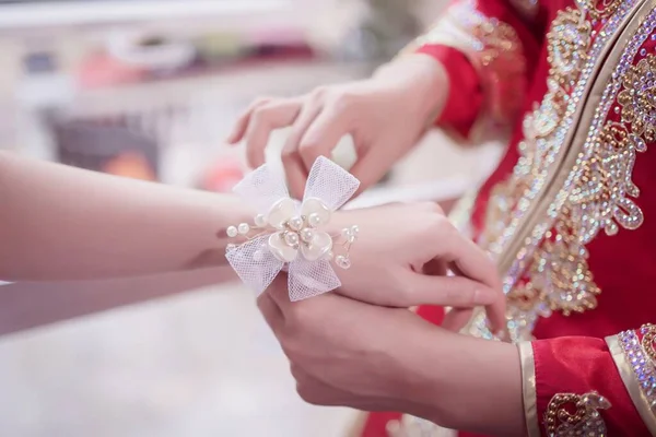 Closeup Bride Putting Bridal Corsage Female Hand — Stock Photo, Image