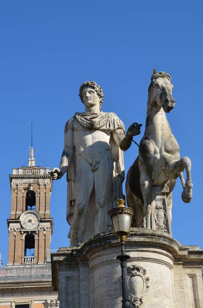 A low angle view of the famous Statue of the Dioscuri in Rome, Italy with the blue sky as background