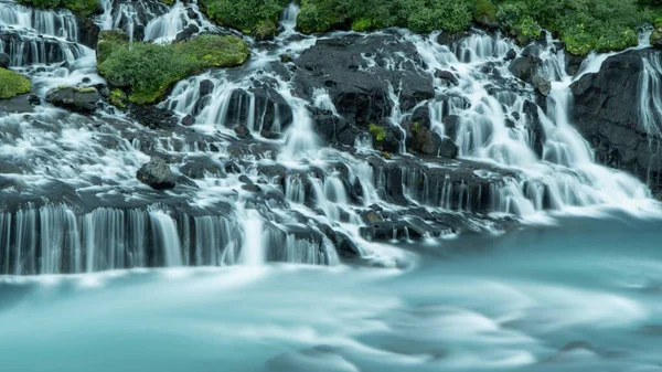 Long Exposure Shot Beautiful Hraunfossar Waterfalls Flowing Rocks — Stock Photo, Image
