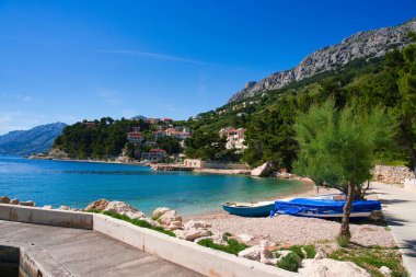 A beautiful view of the sea near the mountains on a sunny day
