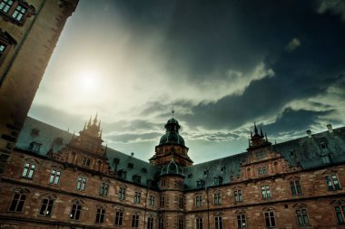 A low-angle shot of Johannesburg Castle with a dramatic sky in the background, Aschaffenburg, Germany clipart