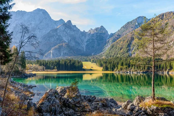 Scenic View Lake Fusine Shallow Water Surrounded Trees Rocks Steep — Stock Photo, Image