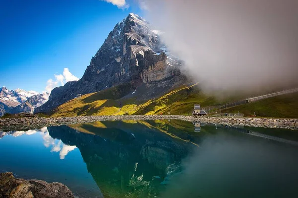 Scenic Shot Eiger Mountain Reflecting Small Lake Blue Sky Switzerland — Stock Photo, Image
