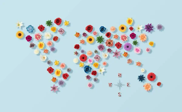 青を背景に様々な色鮮やかな春の花と世界地図のレイアウト — ストック写真