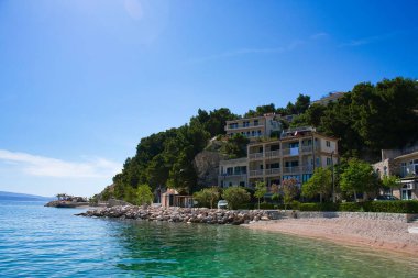 A beautiful view of the sea near the mountains on a sunny day