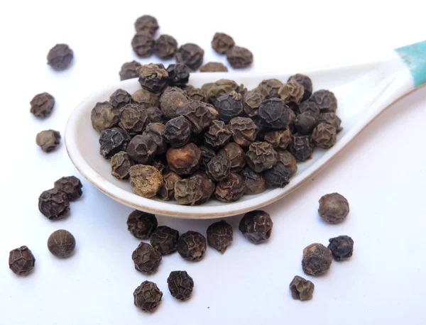 Black pepper is a flowering vine in the family Piperaceae, cultivated for its fruit, known as a peppercorn, which is usually dried and used as a spice