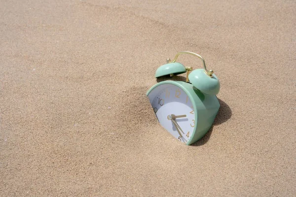 Closeup Green Alarm Clock Half Covered Sand Grains — Stock Photo, Image