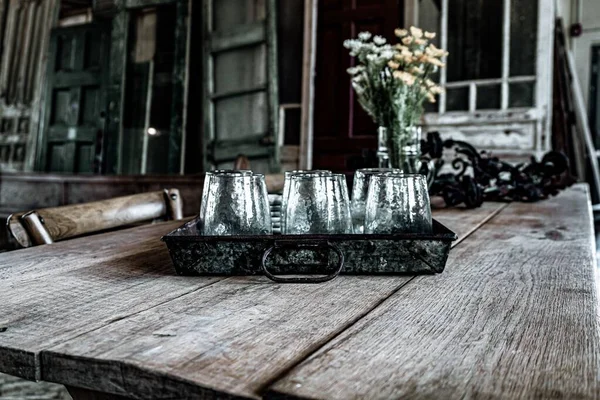 Large Wooden Plank Farmhouse Table Glass Cups Serving Tray Distressed — Stock Photo, Image