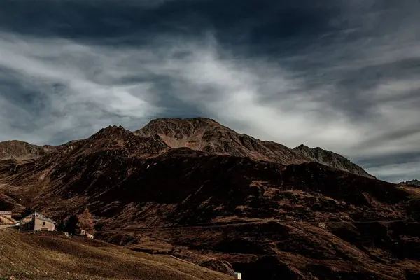 stock image A mesmerizing landscape of the rocky mountains on a dark cloudy day