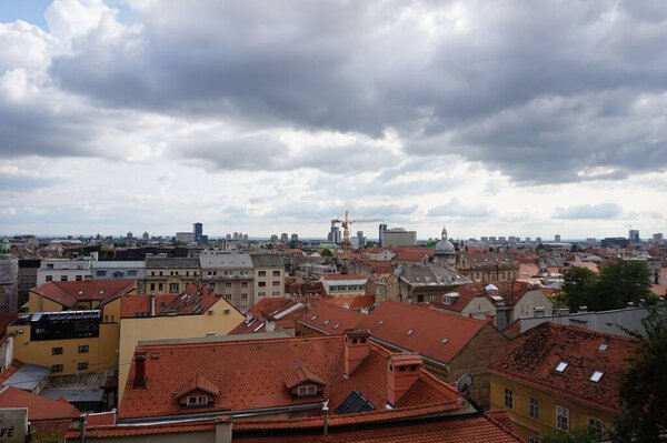 An aerial shot over the red buildings of Zagreb under the cloudy sky, Croatia