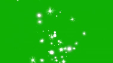 Yeşil arka planda hareket eden parlak ışıklar