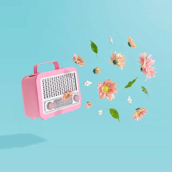 パステルブルーの背景にカラフルな夏の花を持つピンクのヴィンテージラジオ受信機の3D — ストック写真