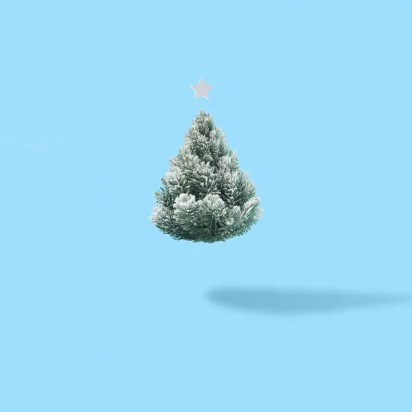 Ένα Χιονισμένο Χριστουγεννιάτικο Δέντρο Ένα Αστέρι Ένα Φωτεινό Μπλε Φόντο — Φωτογραφία Αρχείου