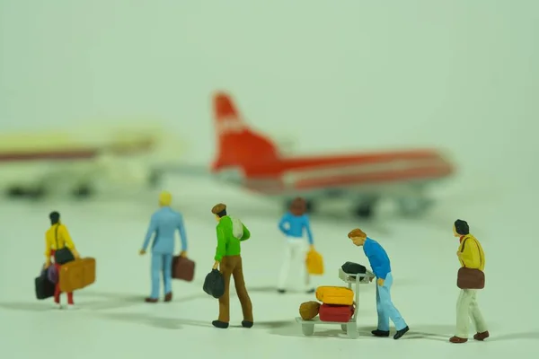 stock image Traveling people with luggage in the airport, miniature figures scene