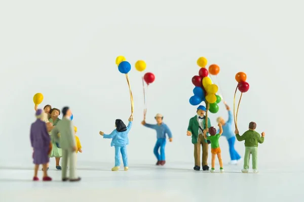 Close Shot Miniature Figurines Man Kids Air Balloons Isolated White — Stock Photo, Image