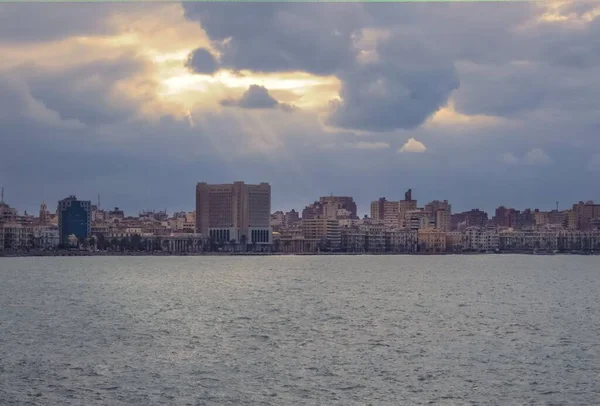 Beautiful Shot Alexandria Cityscape Body Water Foreground Cloudy Sunrise — Stock Photo, Image