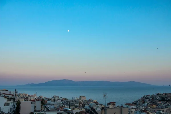 stock image A drone shot of residential buildings on the coast at sunset