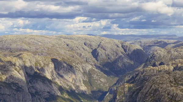 stock image An aerial shot of rocky mountains and valleys surrounding the Lysefjord in southwestern Norway