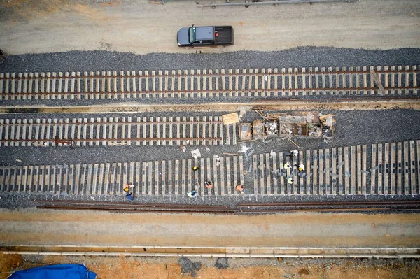 A bird\'s eye view of a train track construction site