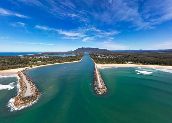 stock image A bird's eye view of Camden Haven Inlet in New South Wales, Australia under a cloudy blue sky