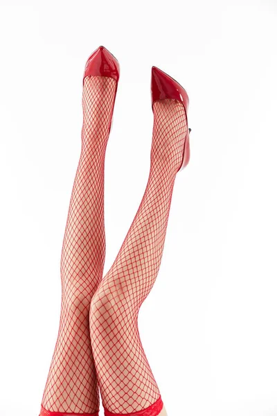 Μια Γυναίκα Όμορφα Πόδια Που Φοράει Κόκκινα Τακούνια Και Κάλτσες — Φωτογραφία Αρχείου