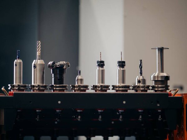 A closeup shot of the process of a metal tool head machining on an isolated background